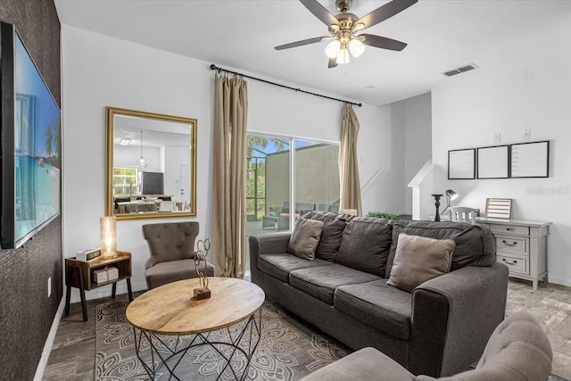 living room with hardwood / wood-style flooring and ceiling fan