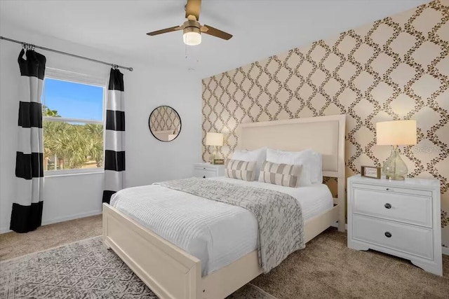 bedroom featuring light colored carpet and ceiling fan