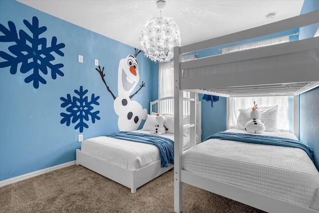 bedroom with carpet and an inviting chandelier