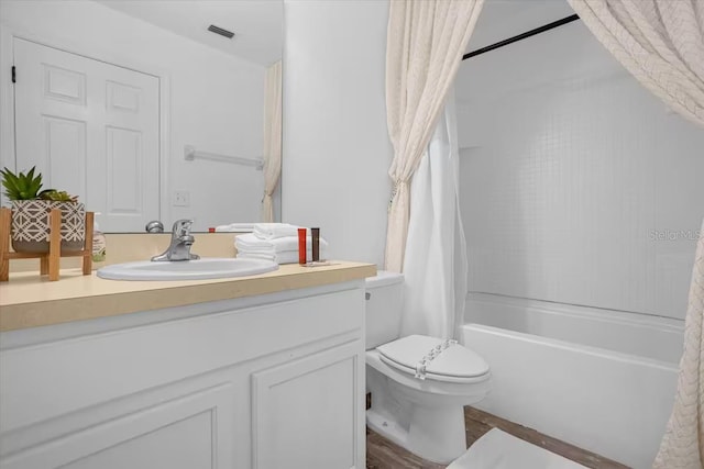 full bathroom featuring vanity, toilet, and shower / bathtub combination with curtain