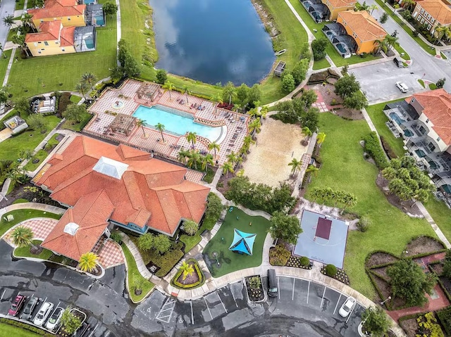 birds eye view of property with a water view