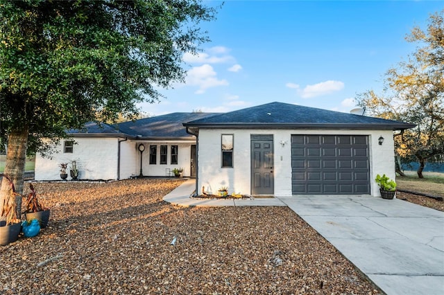 ranch-style home featuring a garage