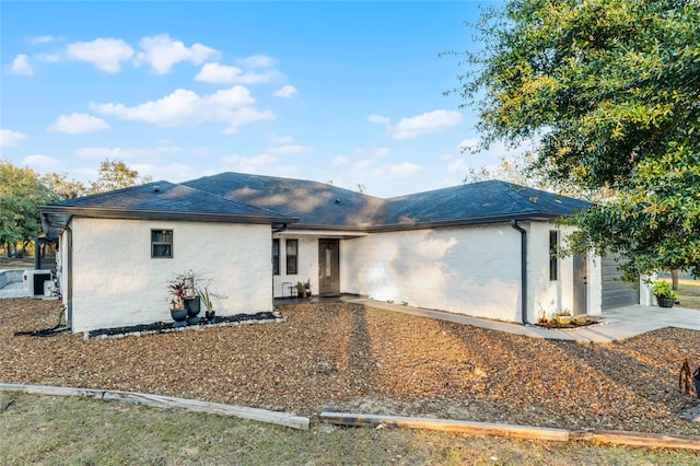 ranch-style home featuring a garage