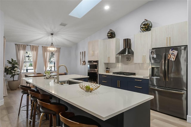 1681 E Evelyn St, Hernando, FL 34442 - kitchen featuring refrigerator with ice dispenser, wall chimney exhaust hood, stainless steel double oven, black cooktop, and a large island