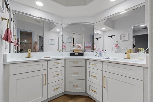 1681 E Evelyn St, Hernando, FL 34442 - full bathroom featuring double vanity, recessed lighting, wood finished floors, and ensuite bath