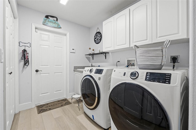 1681 E Evelyn St, Hernando, FL 34442 - washroom with washing machine and dryer, light wood finished floors, and cabinet space