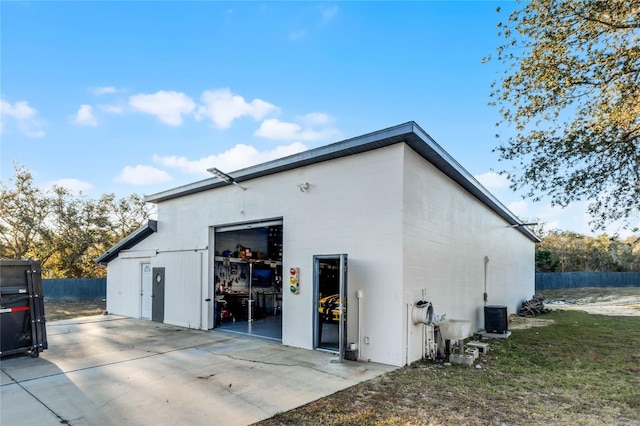 1681 E Evelyn St, Hernando, FL 34442 - view of property exterior with a garage and a patio area