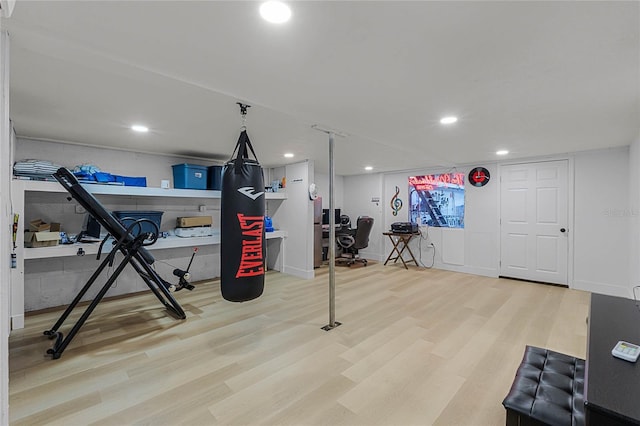 workout area featuring hardwood / wood-style flooring