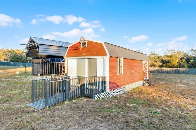 view of side of property with an outdoor structure