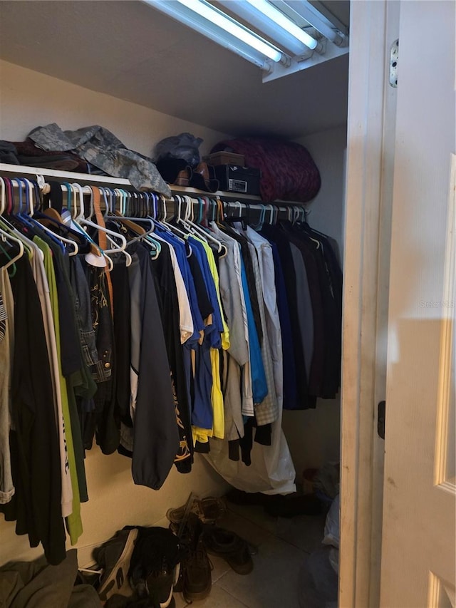 spacious closet featuring tile patterned flooring