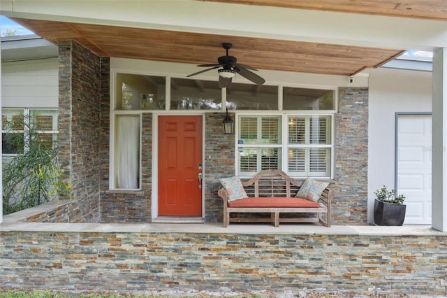 view of exterior entry with ceiling fan