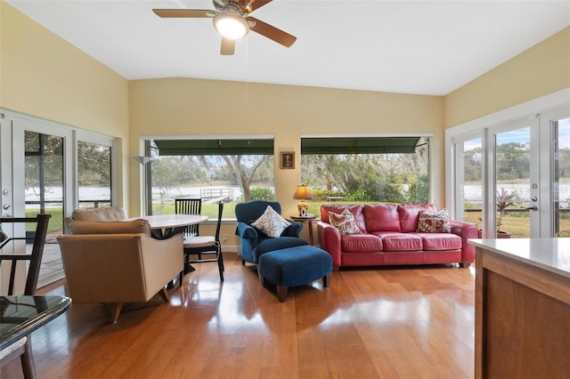 sunroom with ceiling fan and french doors