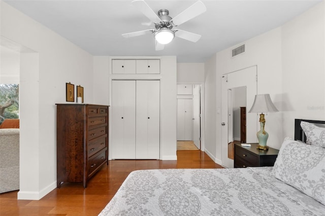 bedroom featuring ceiling fan, a closet, and hardwood / wood-style flooring