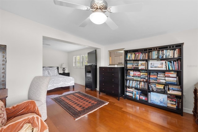 bedroom with hardwood / wood-style flooring and ceiling fan