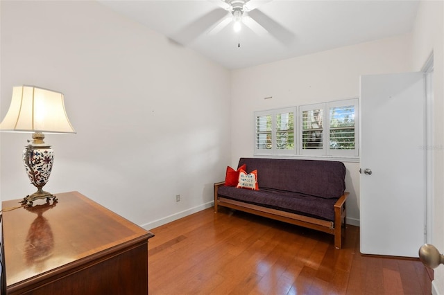 sitting room featuring wood-type flooring and ceiling fan