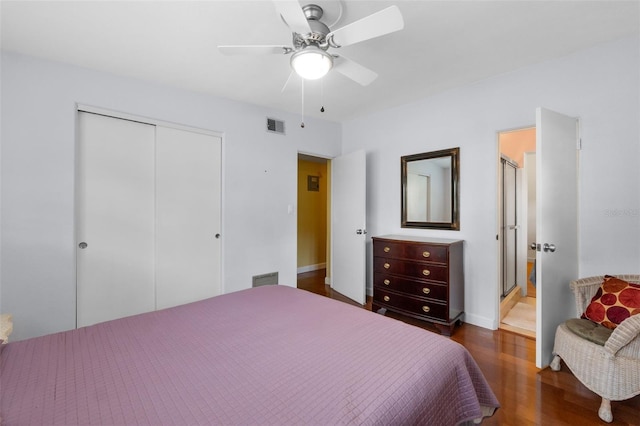 bedroom featuring dark hardwood / wood-style flooring, ceiling fan, and a closet