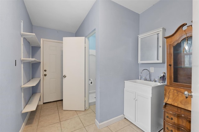 bathroom with tile patterned floors and sink