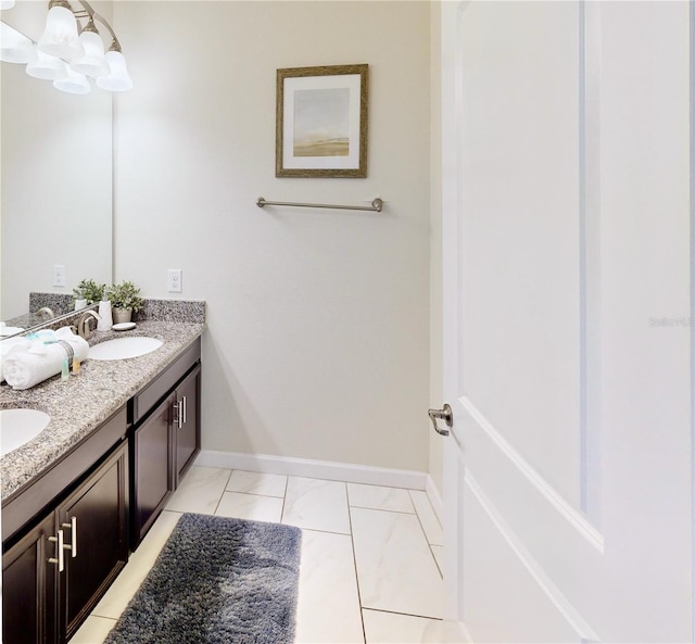 bathroom featuring vanity and a chandelier