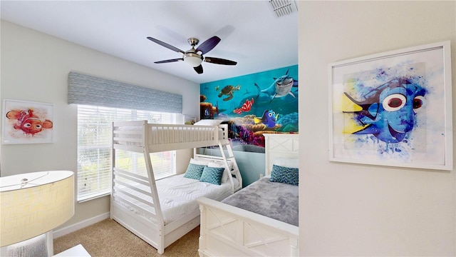 bedroom with ceiling fan and carpet floors