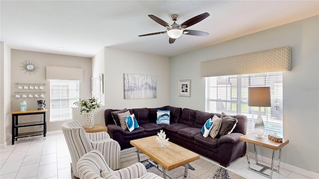 living room featuring light tile patterned floors, plenty of natural light, and ceiling fan