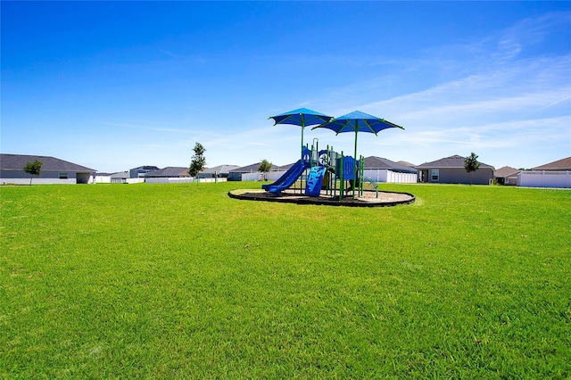 view of play area featuring a lawn