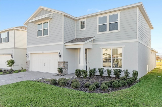 view of front of home featuring a front lawn and a garage