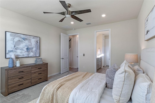 bedroom with visible vents, light colored carpet, ceiling fan, ensuite bathroom, and recessed lighting