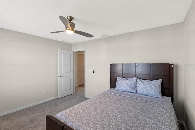 bedroom with light carpet, ceiling fan, visible vents, and baseboards