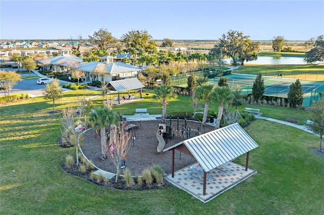 view of property's community with a water view and a gazebo