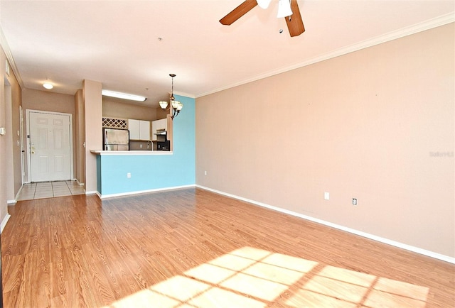 2572 Robert Trent Jones Dr Unit 1231, Orlando, FL 32835 - unfurnished living room featuring baseboards, light wood-style flooring, crown molding, and ceiling fan with notable chandelier