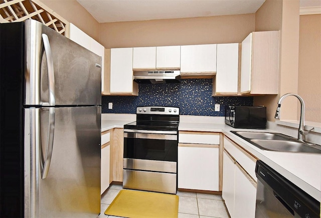 2572 Robert Trent Jones Dr Unit 1231, Orlando, FL 32835 - kitchen featuring light countertops, a sink, under cabinet range hood, and stainless steel appliances