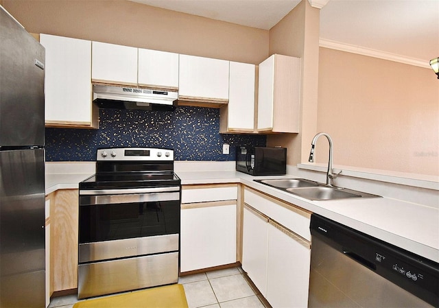 2572 Robert Trent Jones Dr Unit 1231, Orlando, FL 32835 - kitchen featuring appliances with stainless steel finishes, a sink, light countertops, under cabinet range hood, and ornamental molding