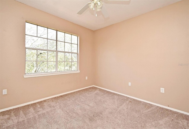 2572 Robert Trent Jones Dr Unit 1231, Orlando, FL 32835 - spare room featuring carpet floors, a ceiling fan, and baseboards