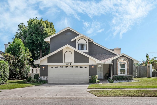 view of front property with a garage and a front lawn