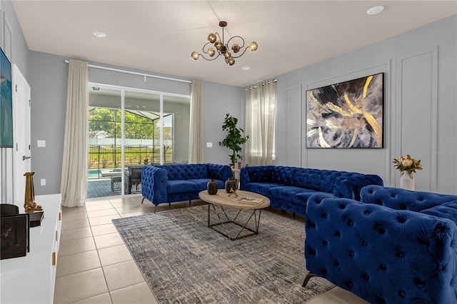 living room featuring light tile patterned floors and an inviting chandelier