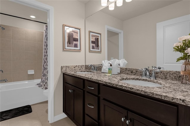 full bathroom featuring tile patterned flooring, vanity, toilet, and shower / tub combo with curtain