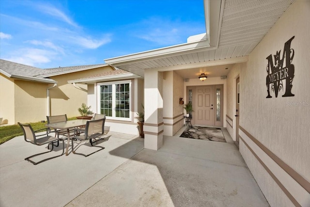 doorway to property with a patio