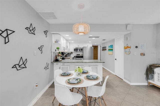 view of tiled dining space