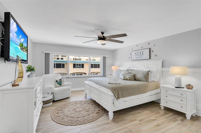 bedroom featuring ceiling fan and light wood-type flooring