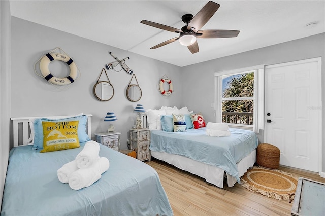 bedroom with ceiling fan and wood-type flooring