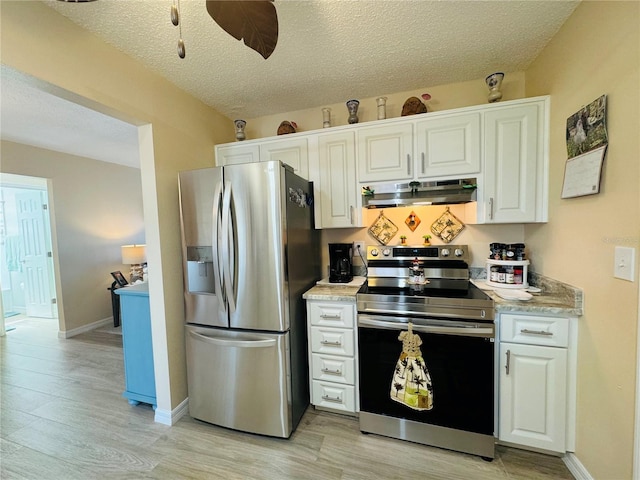 kitchen featuring stainless steel appliances, white cabinetry, a textured ceiling, and light wood-type flooring