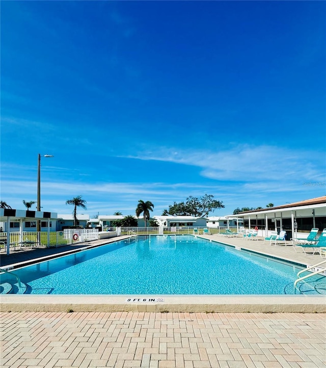 view of swimming pool with a patio