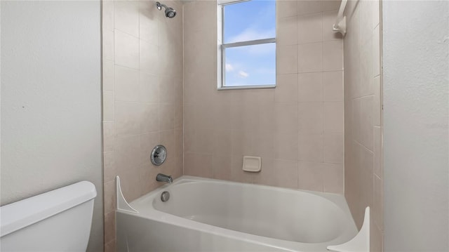 bathroom featuring toilet and shower / tub combination