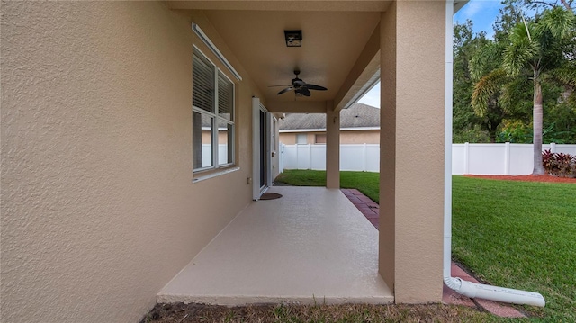 view of patio / terrace featuring a ceiling fan and fence