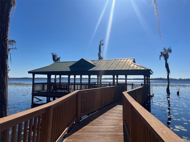 dock area featuring a gazebo and a water view