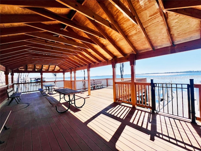 deck with a gazebo and a water view