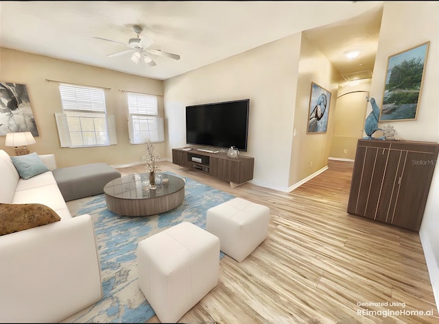 living area with wood finished floors, baseboards, and ceiling fan