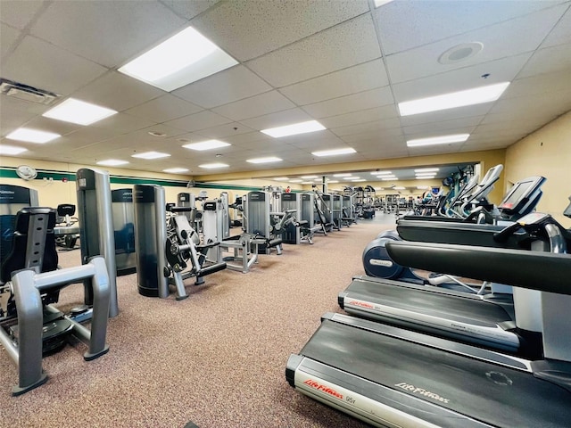 gym featuring visible vents and a drop ceiling