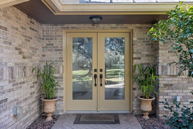 view of exterior entry featuring french doors