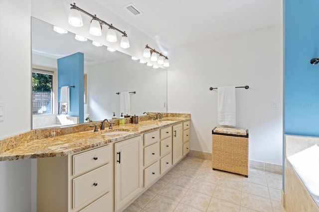 bathroom featuring tile patterned flooring and vanity